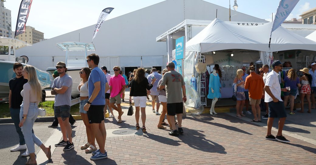 Exhibitor tents at the Palm Beach International Boat Show with many visitors walking around
