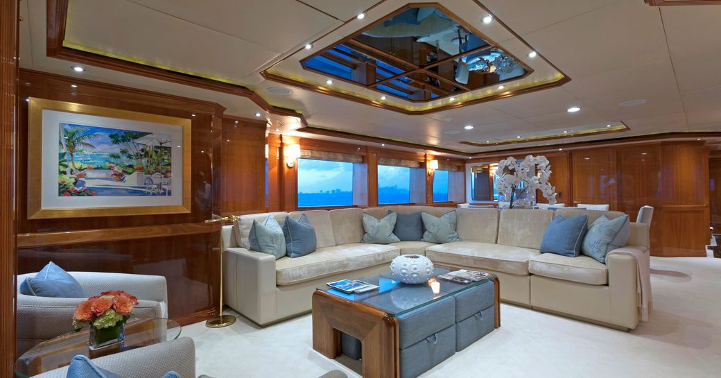 elegant main salon with sociable lounge aboard charter yacht TEMPTATION