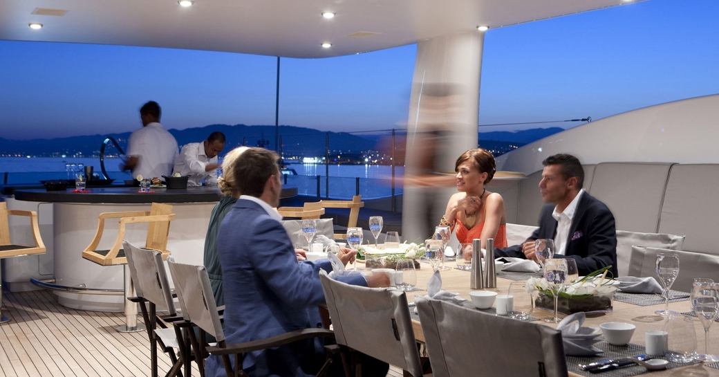 charter guests dine on the sundeck of superyacht SPIRIT
