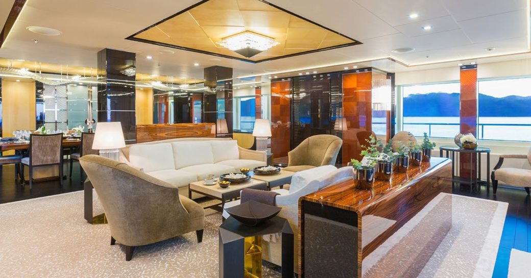 art deco-inspired main salon with sumptuous seating area on board superyacht Party Girl