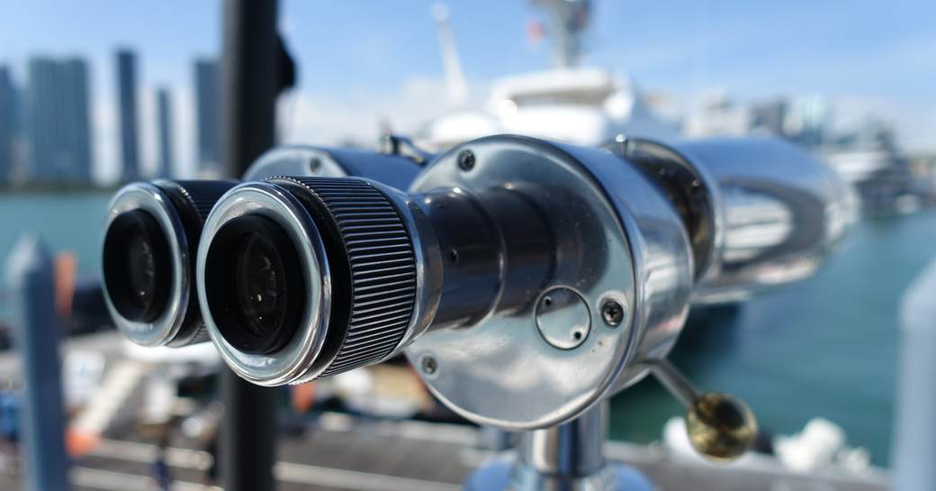 binoculars and yachts at miami yacht show