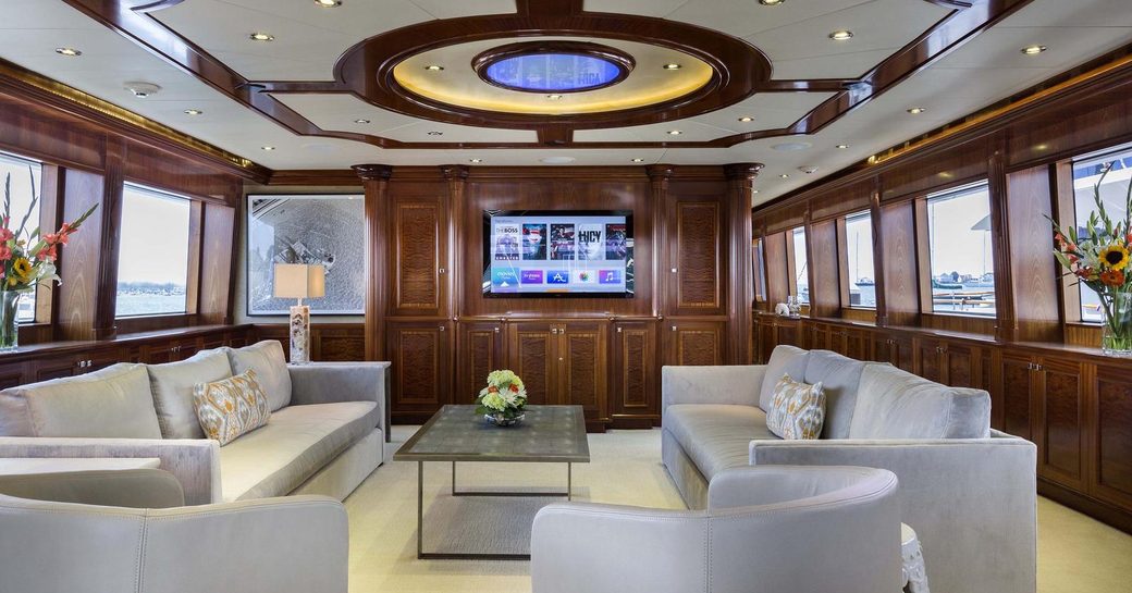 sumptuous sofas and armchairs form the seating area in the main salon aboard superyacht Far From It 