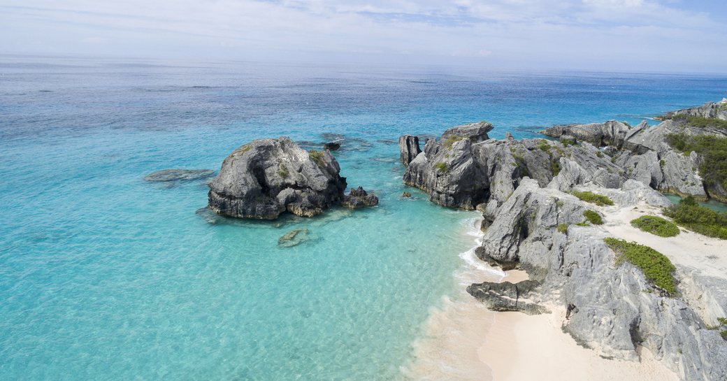 white sand, rocky cliffs and turquoise waters of Bermuda