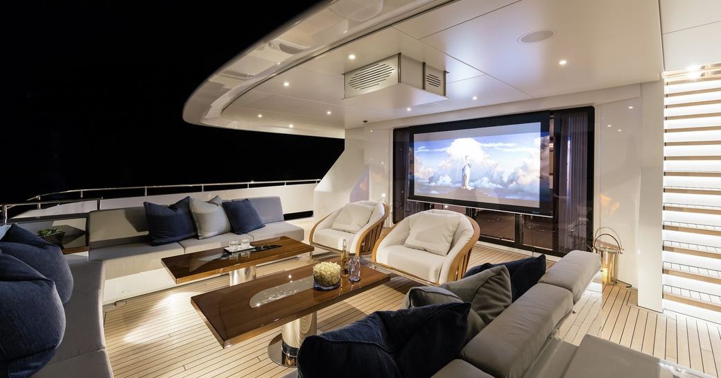 Screen showing movie on aft deck of luxury yacht LAURENTIA