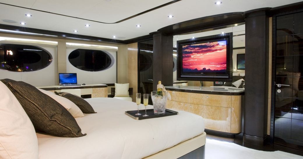 Master stateroom with television on board charter yacht GRENADINES III