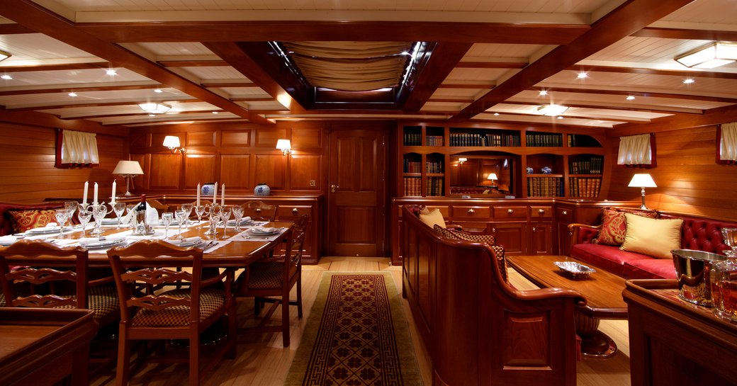 formal dining and lounge area in the classically styled main salon aboard superyacht ELENA