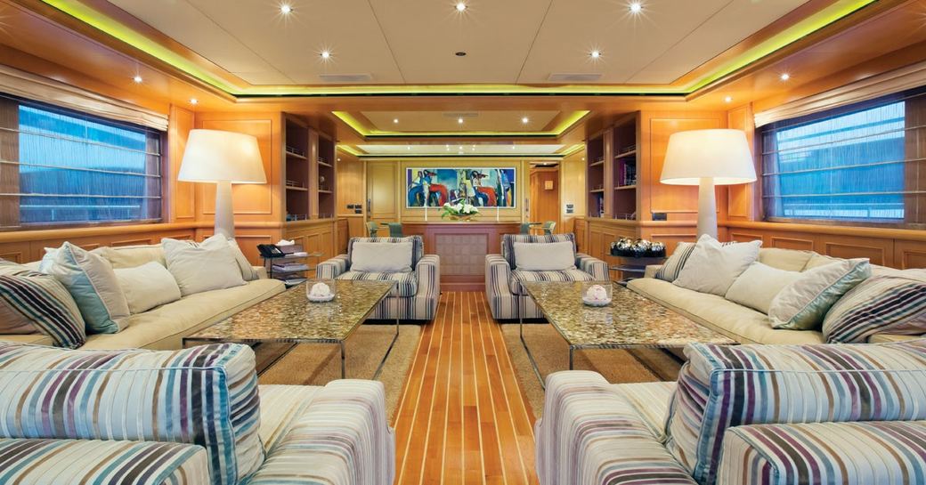 contemporary main salon with pastel hues and warm woods on board superyacht HANA 