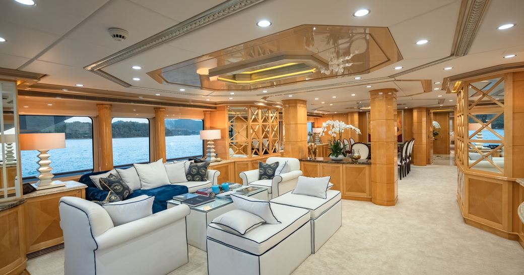 Overview of the main salon onboard charter yacht LADY AZUL, lounge area in foreground