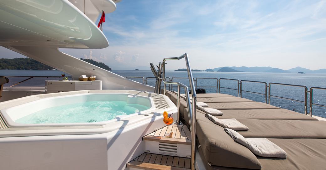 Jacuzzi and sun pads on sundeck aft of motor yacht ‘Seven Sins’ 