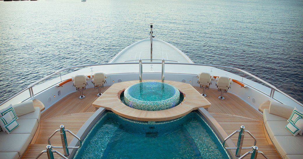 Split level pool on main deck of superyacht KISMET, with ocean in background