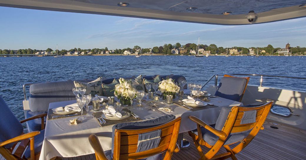 al fresco dining table on the main deck aft of luxury yacht SAVANNAH 
