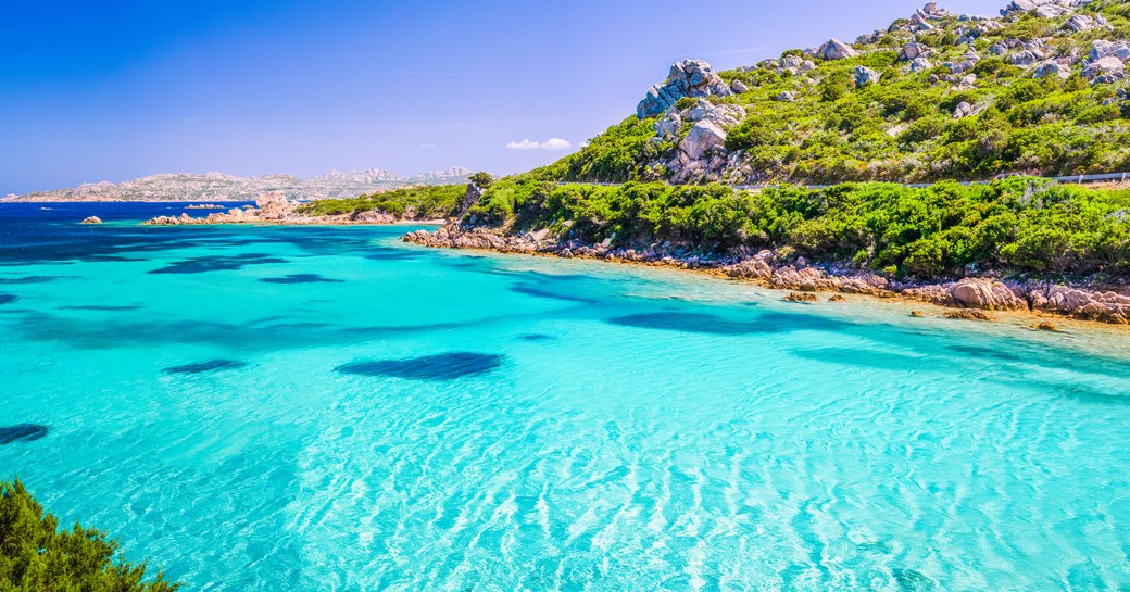 superyacht destination porto cervo and one of its beaches with crystal clear waters