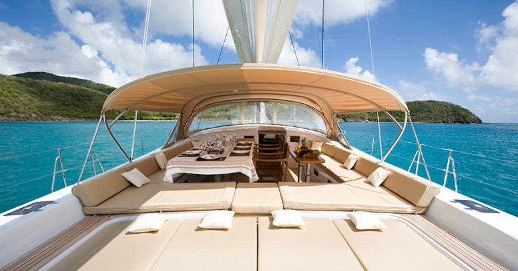 sun pads and seating and dining areas on the uncluttered deck of luxury yacht RAPTURE
