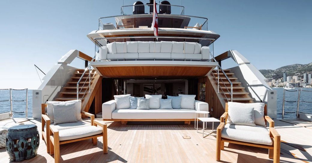Charter yacht LA LA LAND aft decks, with multiple alfresco lounging areas visible