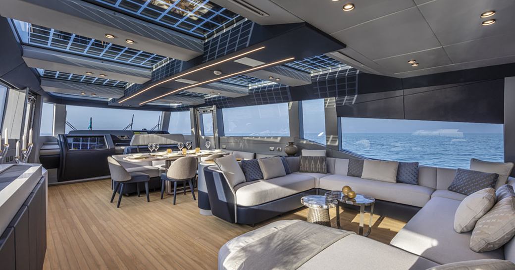 Interiors of motor yacht HAZE with large windows and lots of seating