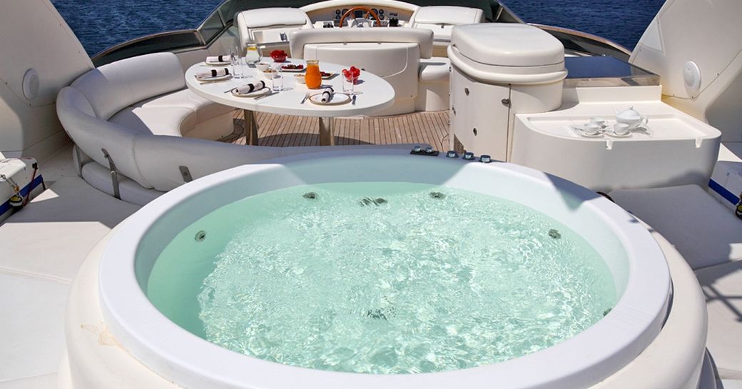 Jacuzzi and seating area on deck SKAZKA