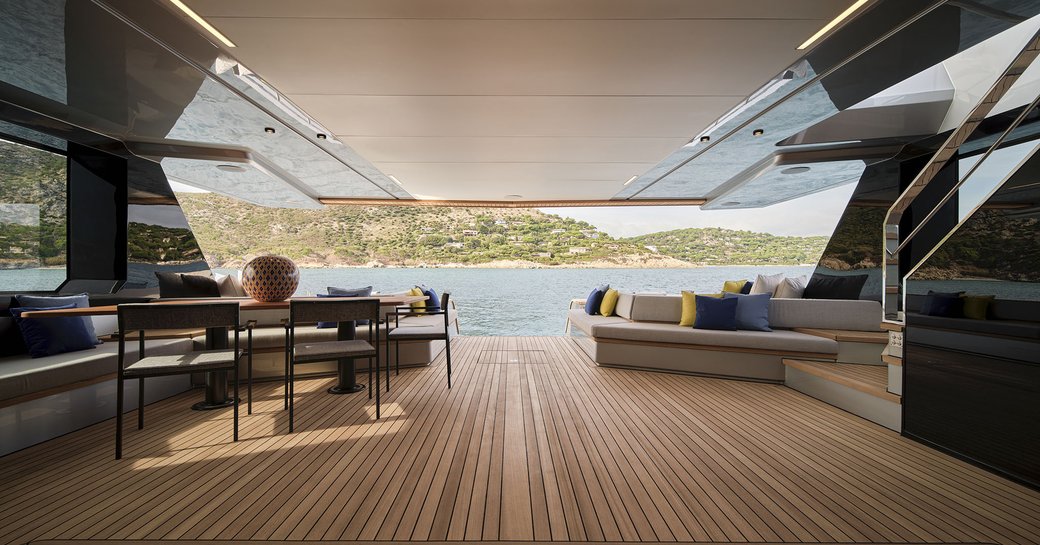 open deck space looking out onto blue waters onboard wally charter yacht bad mutha