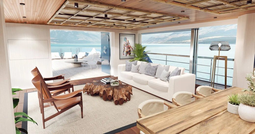Interior lounge area onboard charter yacht KING BENJI, surrounded by large full-height windows