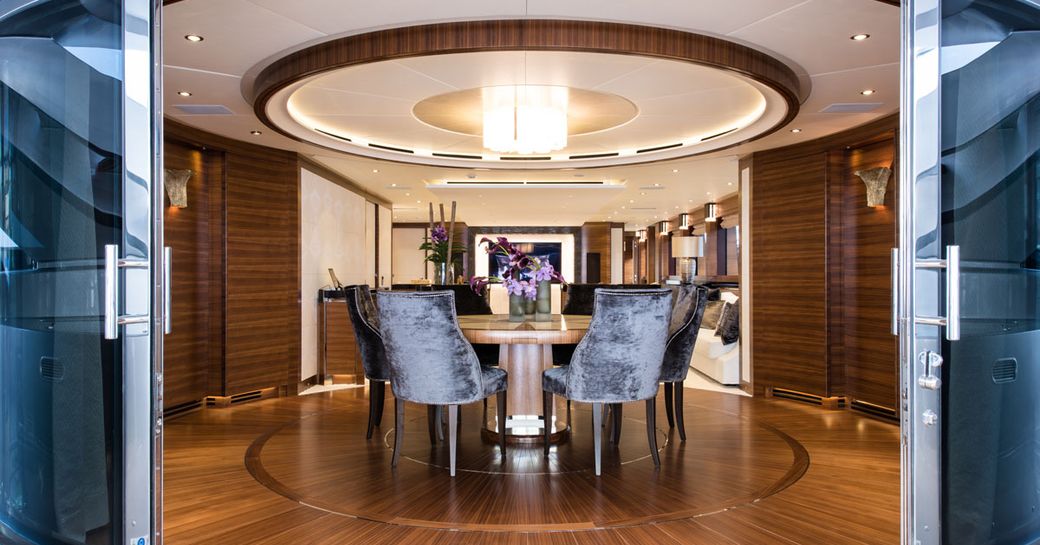 circular dining table and sliding doors on board superyacht ‘Silver Wind’ 