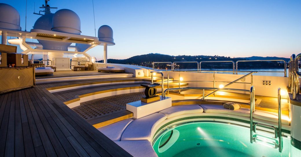 sunken jacuzzi on sundeck with articulated levels on board luxury yacht Coral Ocean
