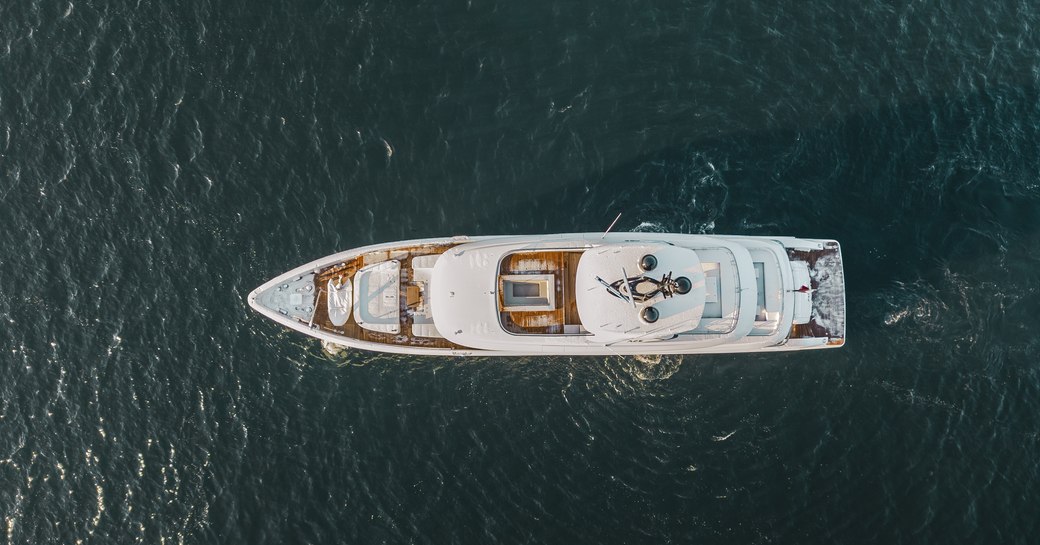 Aerial view of charter yacht ACE, looking directly down from a bird's eye view, surrounded by sea.
