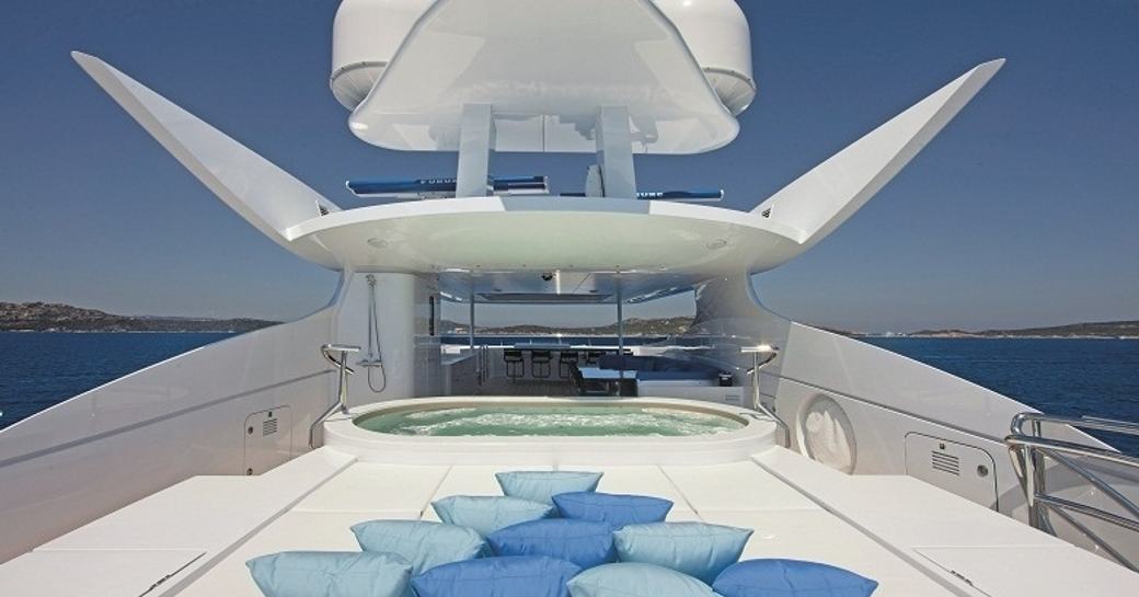 forward section of the sundeck of motor yacht INCEPTION with sunpads and 12-person Jacuzzi