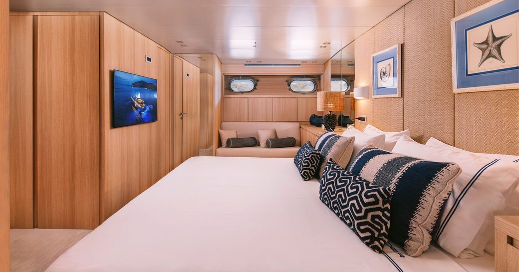 Master cabin onboard charter yacht ISLANDER II, central berth facing port with widescreen TV wall-mounted