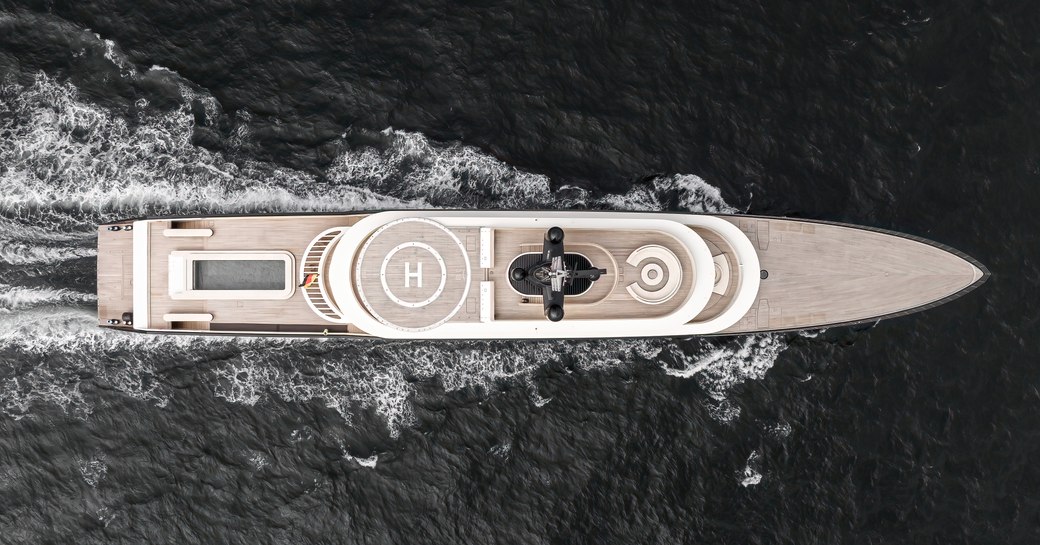 Aerial running shot of charter yacht LIVA° surrounded by sea.