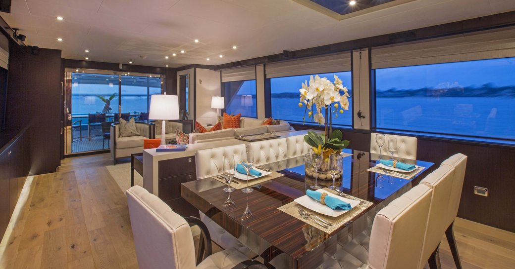 high-gloss dining table in main salon of superyacht ‘Lady Carmen’