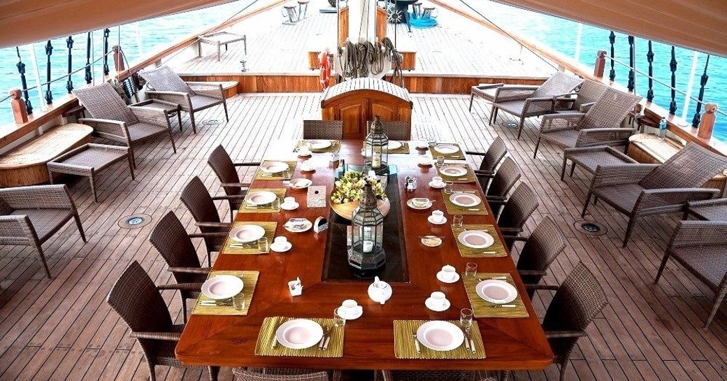 table set for dining on the deck of luxury yacht Mutiara Laut 