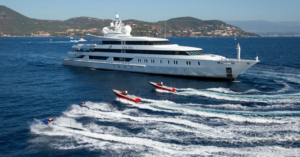 superyacht ‘Indian Empress’ anchors as tenders take to the water on a luxury yacht charter