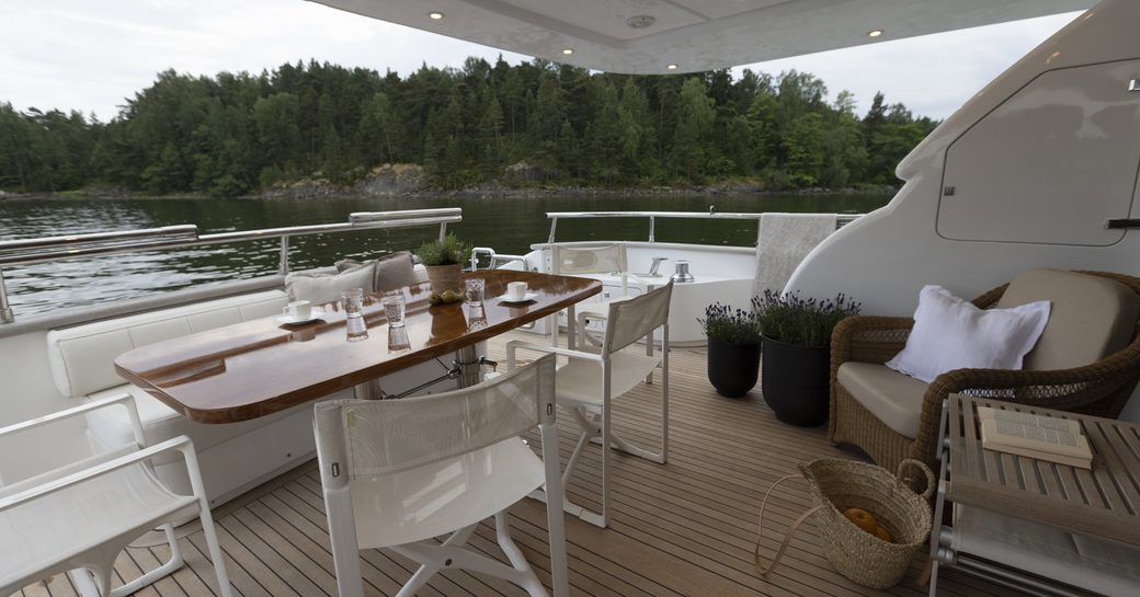 Main deck dining area on board charter yacht XUMI
