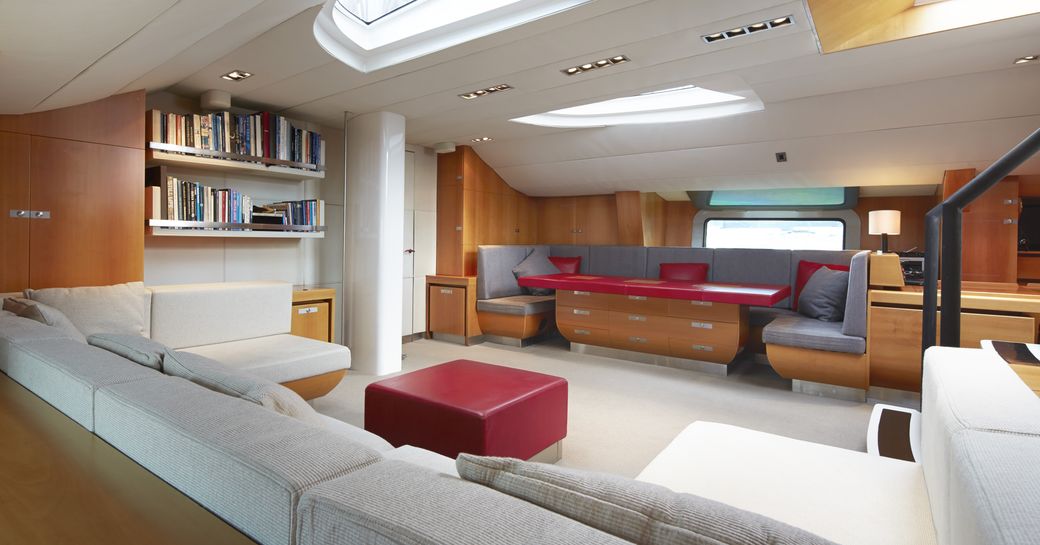 main salon with dining area and library on board luxury yacht SILVERTIP