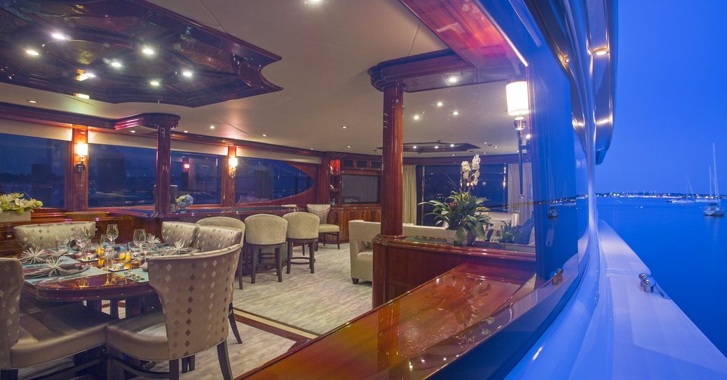 view of main salon of superyacht ‘Gale Winds’ from her wraparound deck
