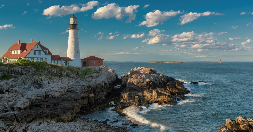 A lighthouse overlooking a bay in New England, Maine.