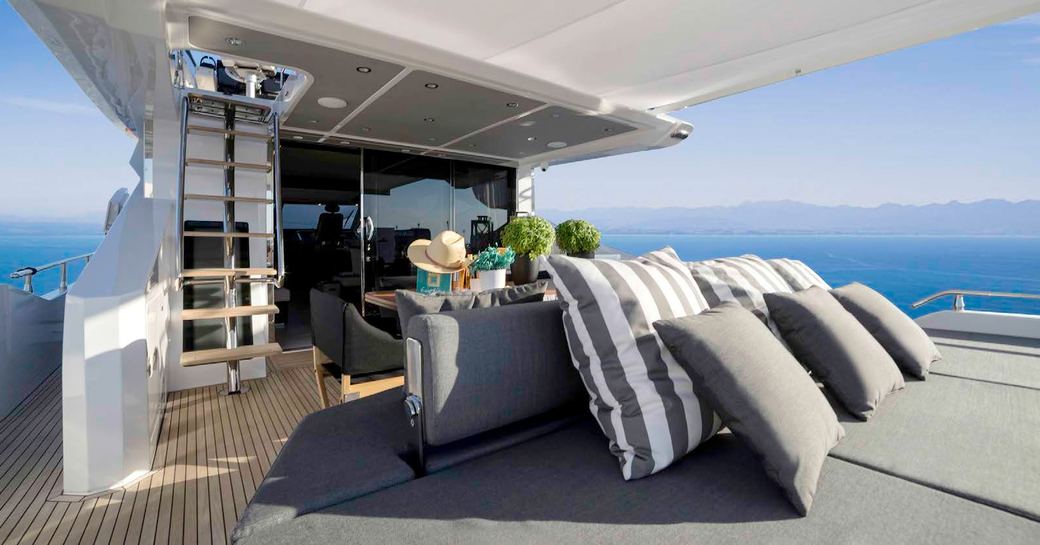 seating area on aft deck of motor yacht