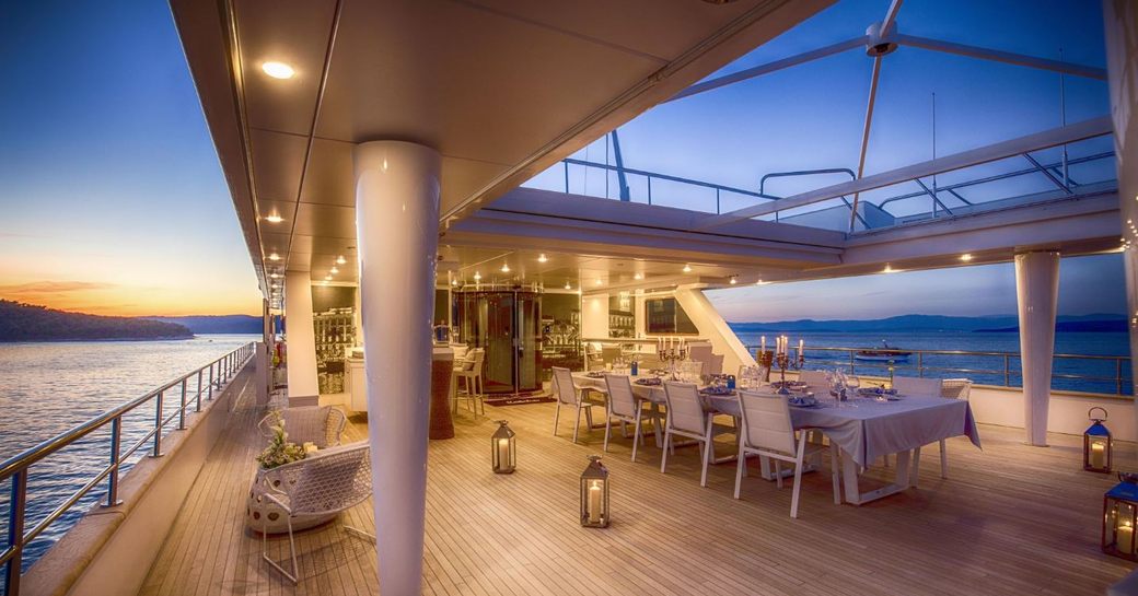 Sun deck with dining area on board superyacht KATINA