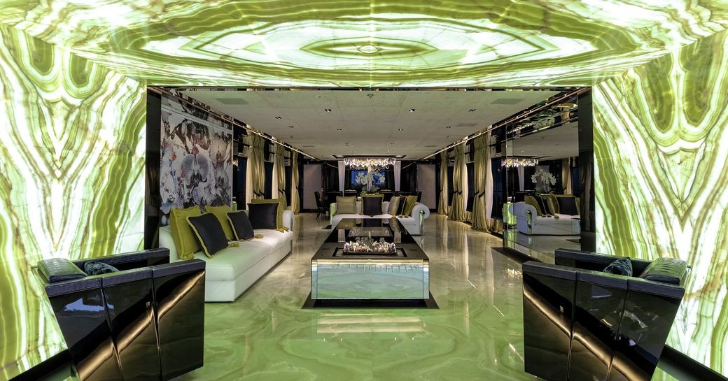 Main salon of superyacht sarastar with green marble