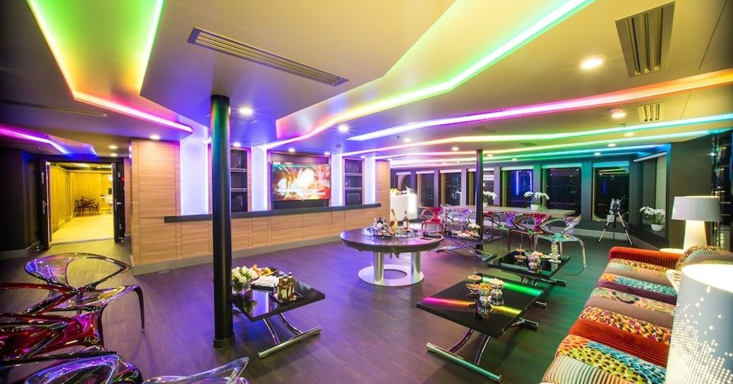 The colorful lighting in the main salon of luxury yacht SALUZI