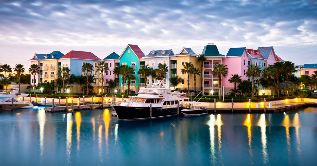 seeing bright buildings and yachts and harbour island shore on our bahamas luxury yacht charter