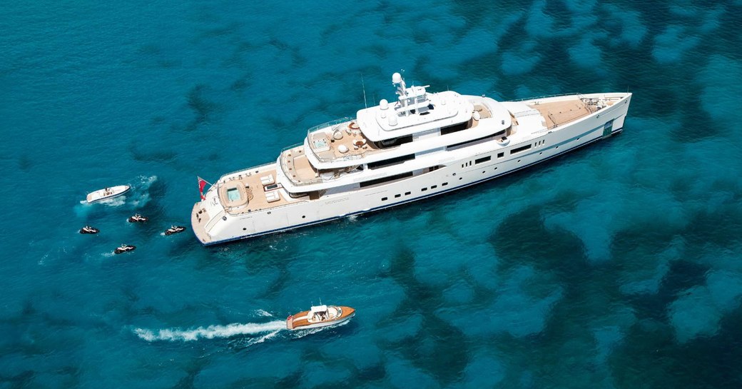 Superyacht 'Grace E' surrounded by tenders and Jetskis