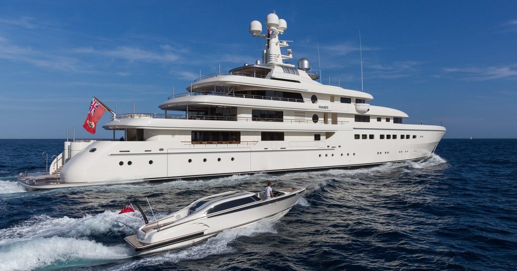 superyacht RoMEA cruises on a charter vacation alongside tender in the Caribbean
