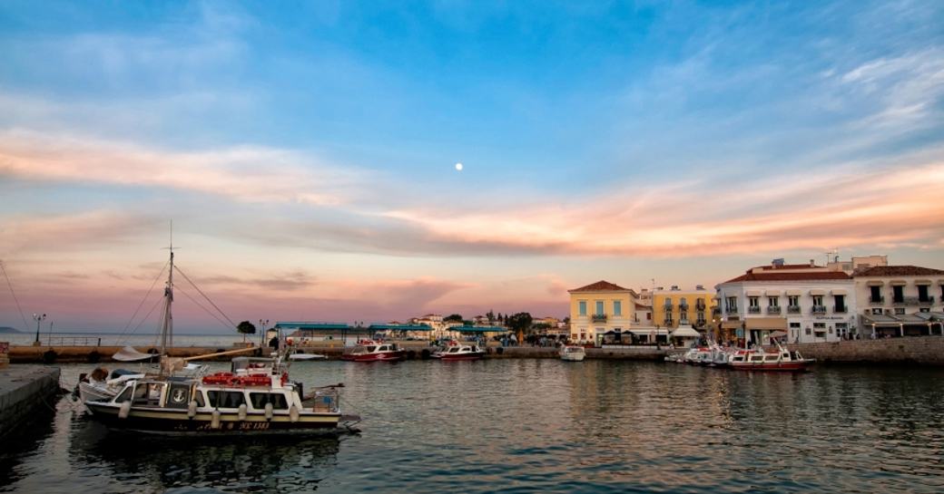 The sun sets over the beautiful port of Spetses
