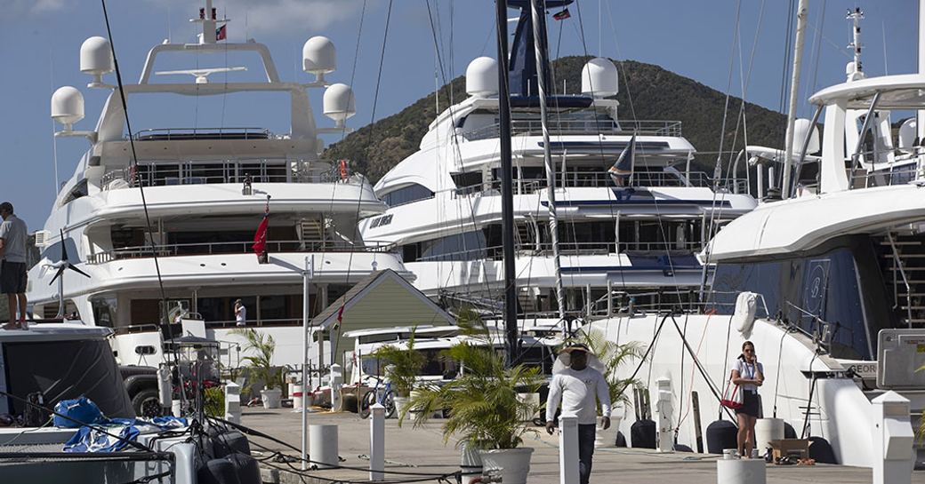Aft view of superyachts berthed at the Antigua Charter Yacht Show
