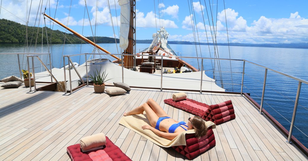 sun pads spread across the clear expanse of the upper deck on board luxury phinisi LAMIMA 