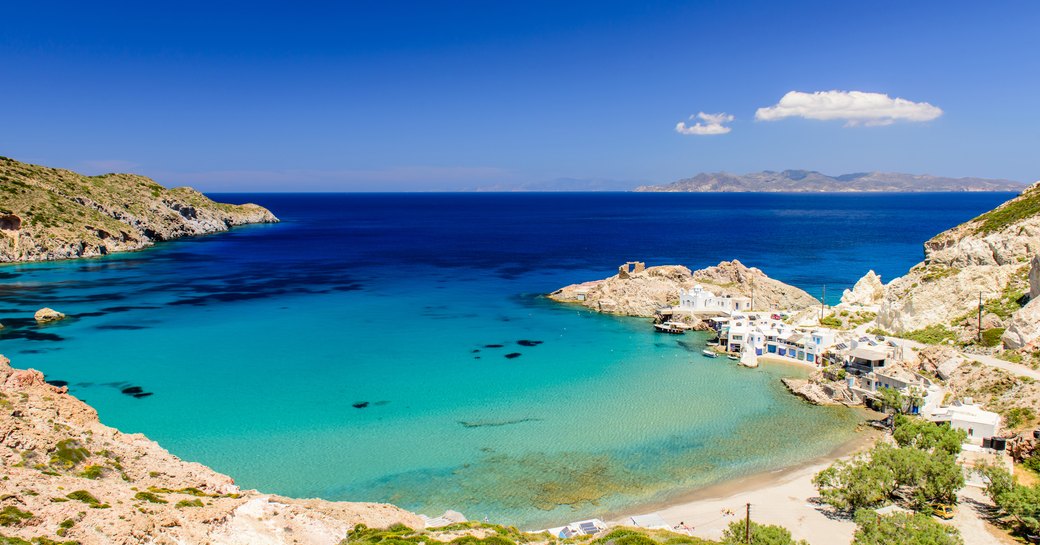 Bay in Greece, with turquoise water and rugged landscape surrounding