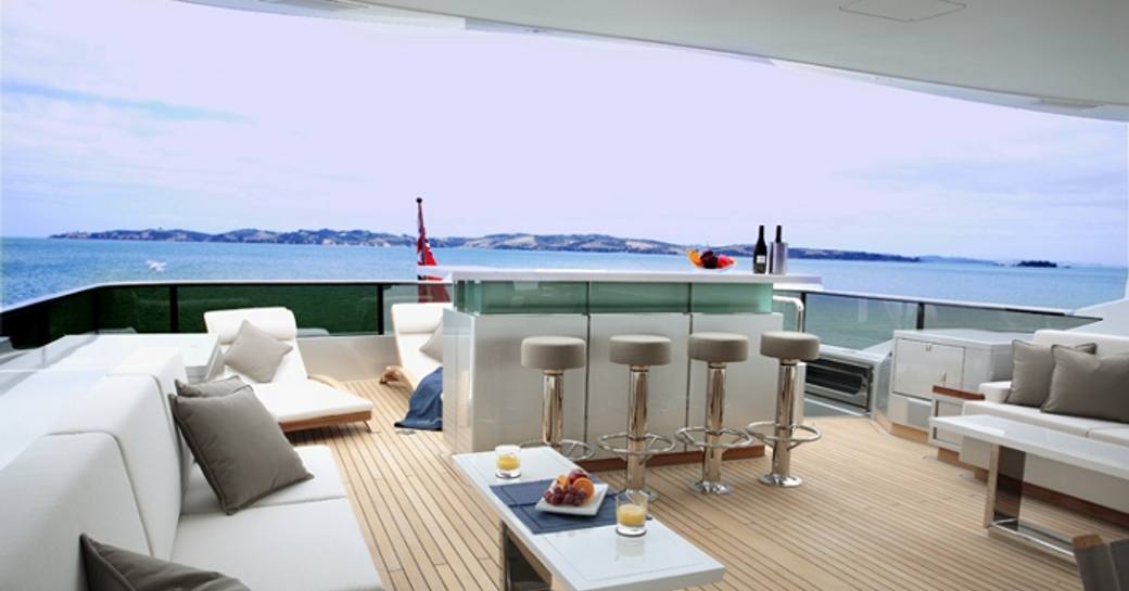 luxury motor yacht POLLY's bar and seating area aft deck