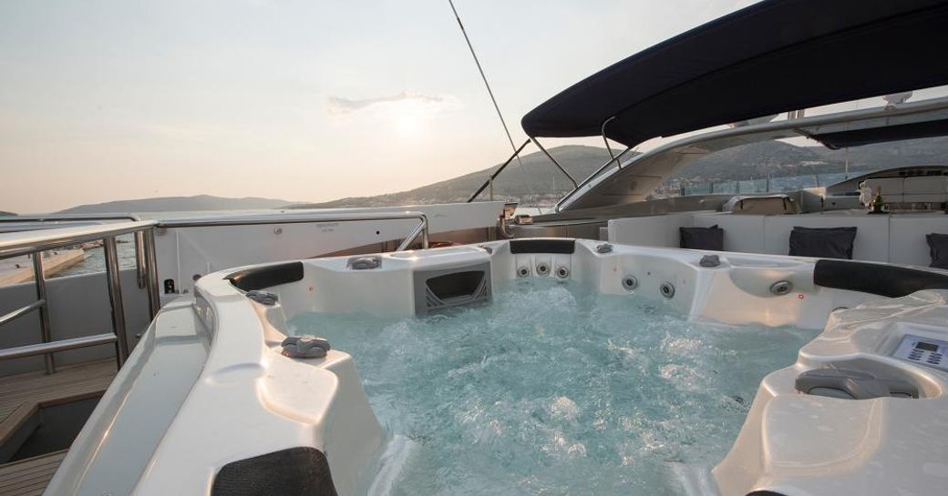 Luxury yacht One Blue jacuzzi pool, with views over Italy in background