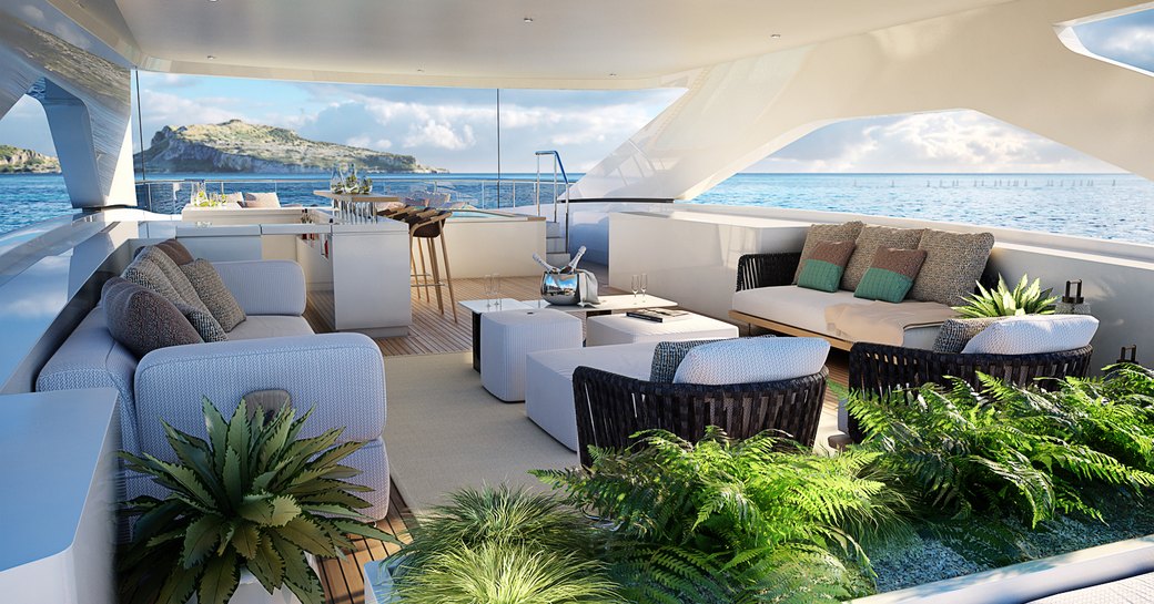 Exterior deck space onboard motor yacht IRIS BLUE with abundant seating an an array of ferns.