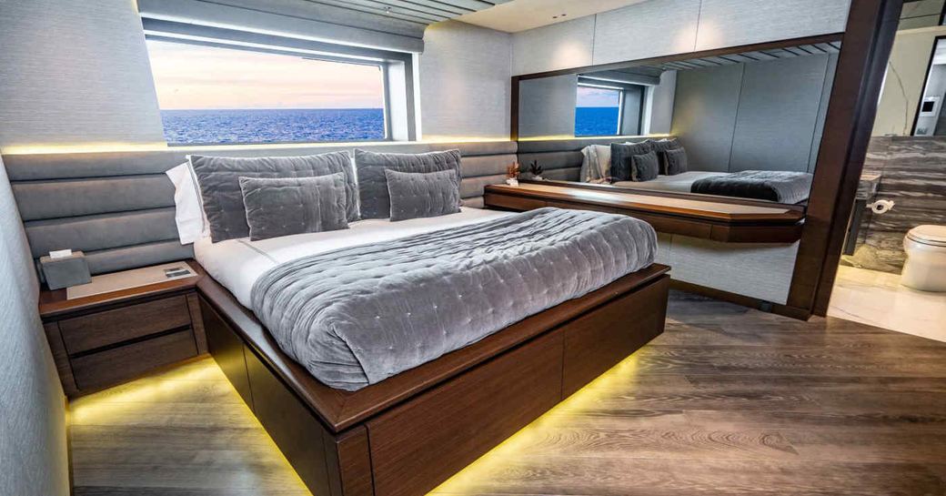 Master cabin onboard charter yacht BABAS, central berth facing forward with large window aft